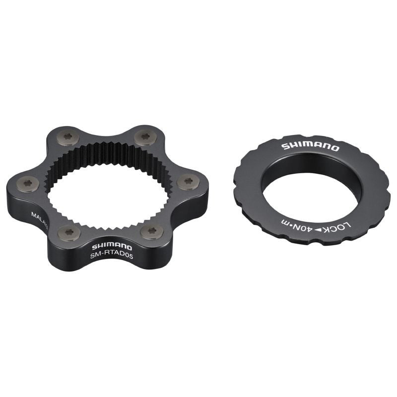 ADAPTATEUR FREIN A DISQUE TRANSFORME FIXATION DISQUE CENTERLOCK SHIMANO EN 6 TROUS POUR AXE TRAVERSANT (ORIGINE)